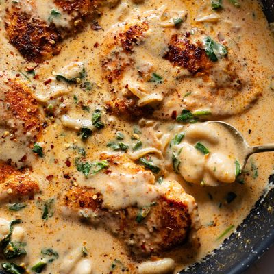 Creamy chicken and gnocchi in a skillet.