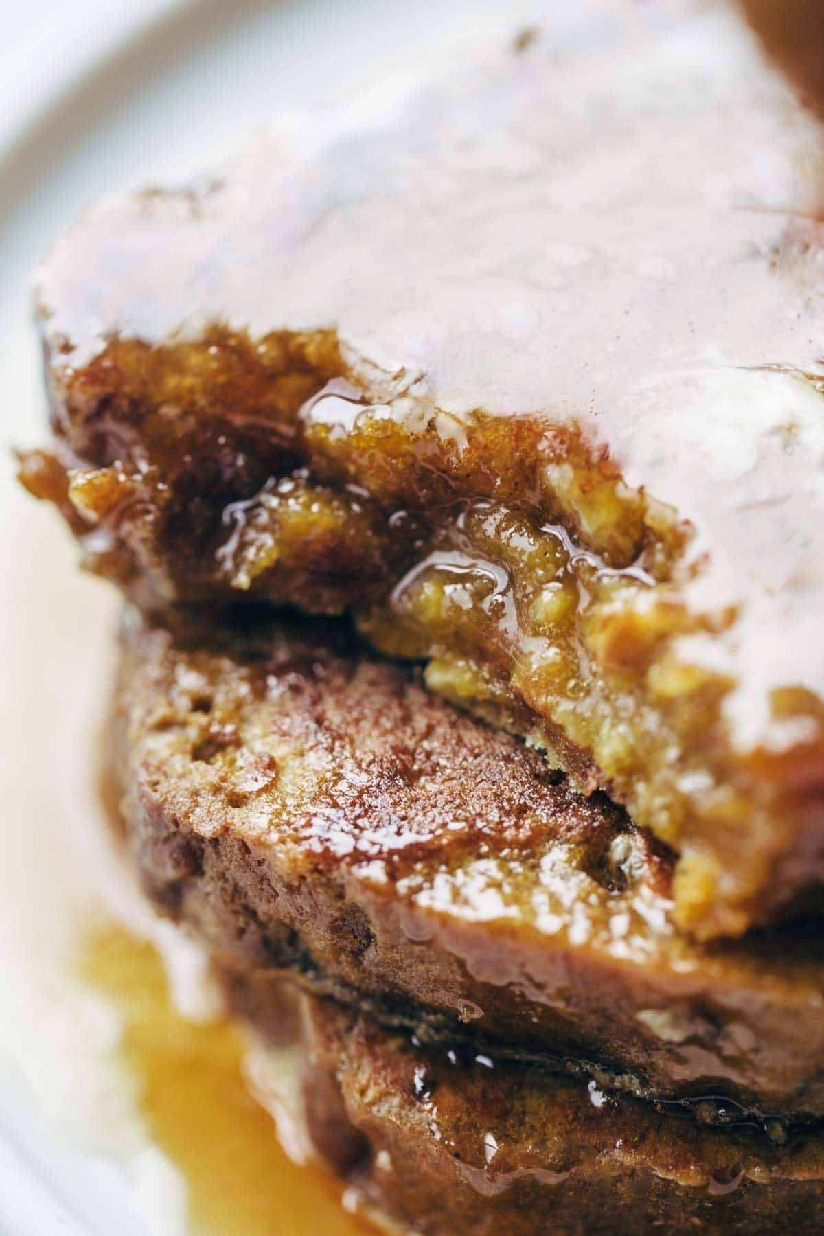 Pumpkin Bread French Toast - easy recipe with eggs, milk, vanilla, and a few pieces of pumpkin bread. Golden brown, sticky sweet brunch perfection. | pinchofyum.com