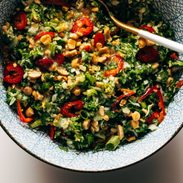 Peanut kale salad in a bowl with a spoon