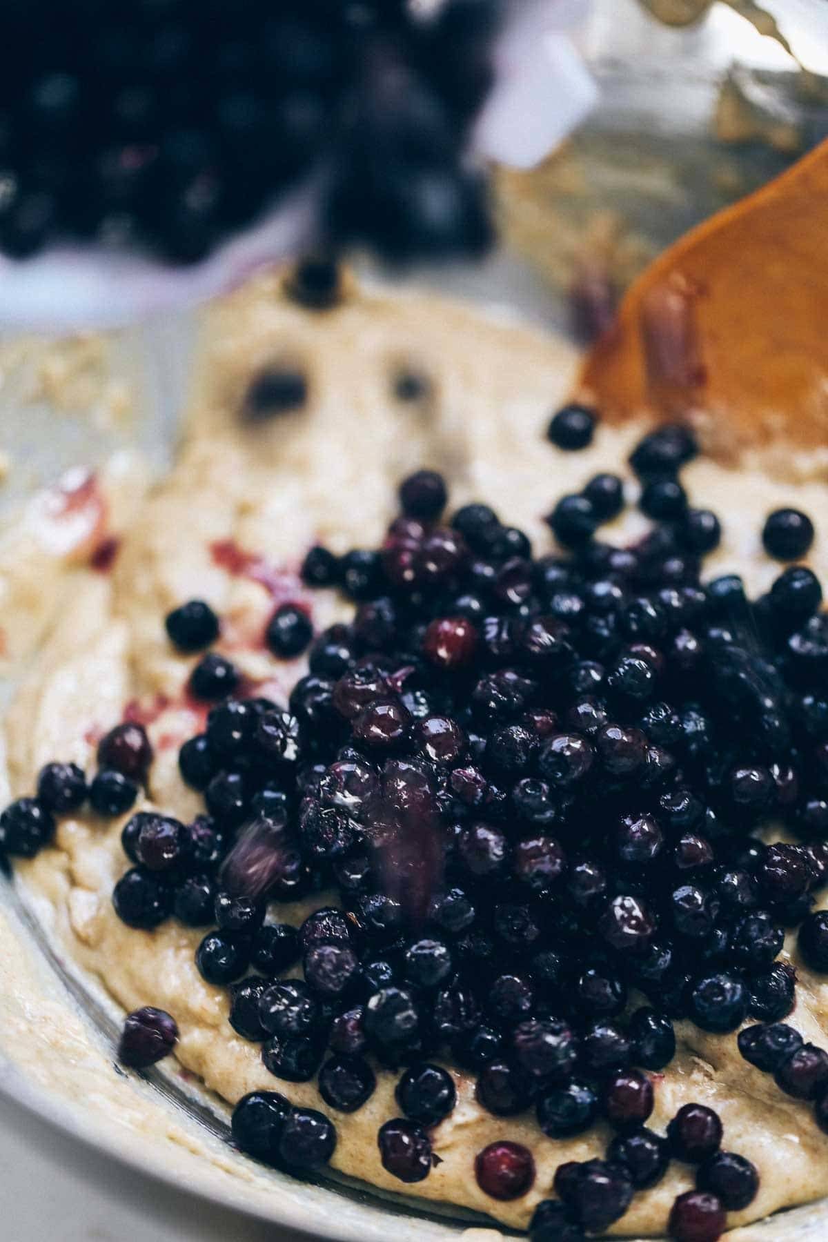Blueberries in muffin batter.