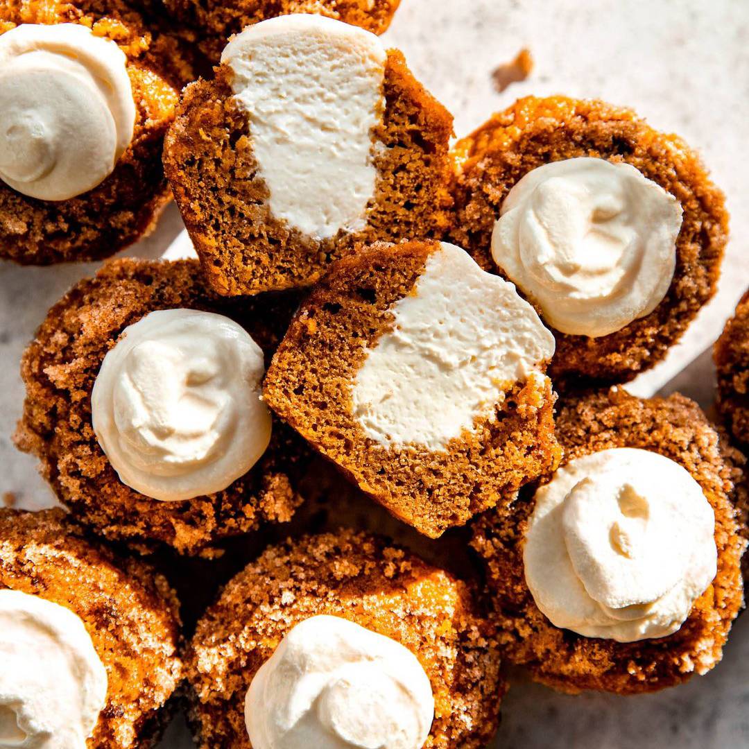 Pumpkin muffins with cream cheese filling.