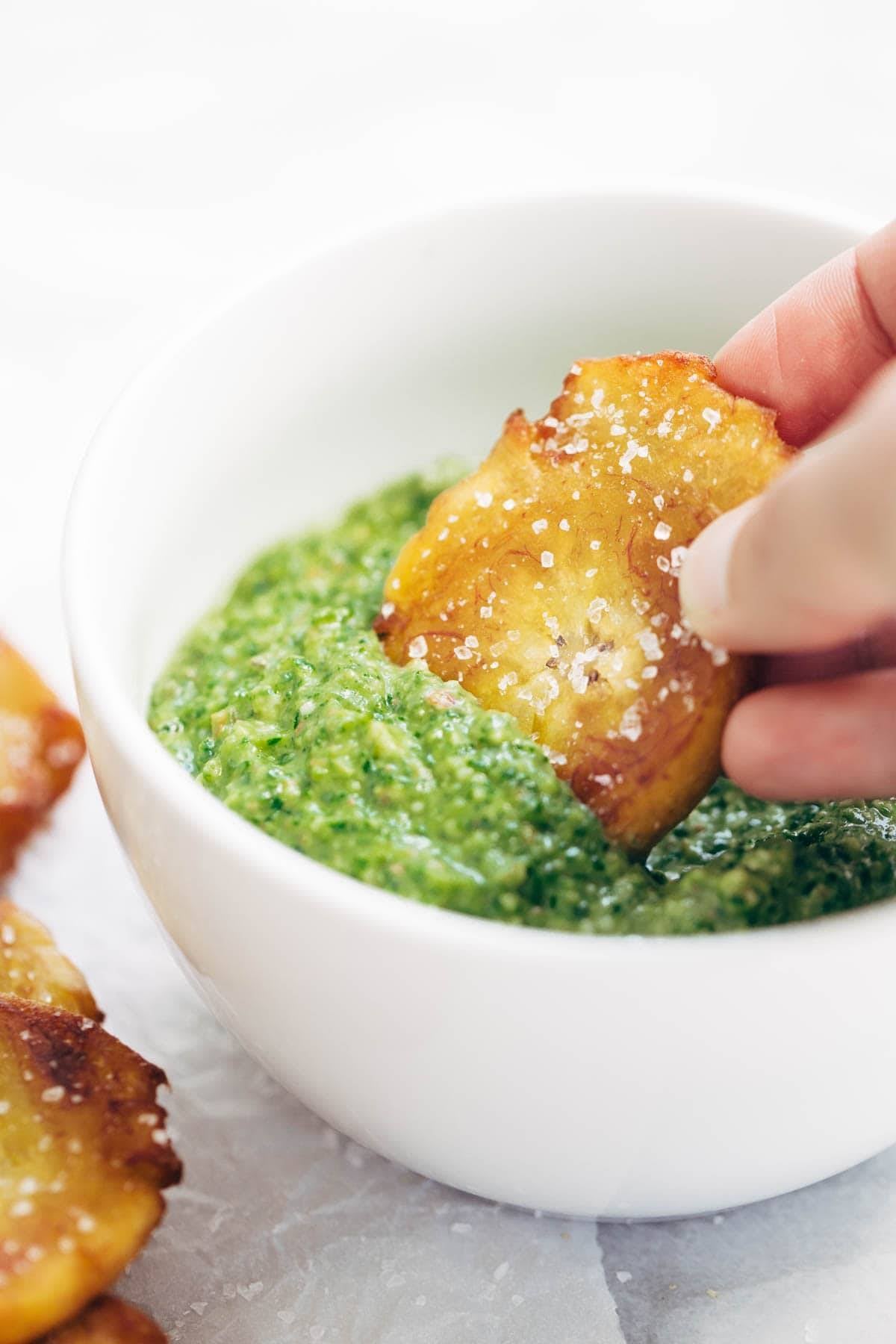 Crispy Salted Tostones - super easy recipe for golden brown bites of perfection with just one ingredient: PLANTAINS! video demo in the post. | pinchofyum.com